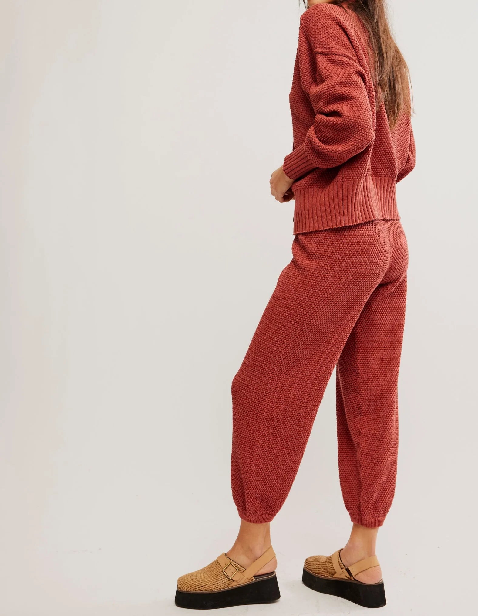 Free People Hailee Cardi Set featuring a soft, knit fabric with a relaxed fit. The set includes a long-sleeve, open-front cardigan and matching knit pants, offering a cozy and stylish look, perfect for casual wear or lounging, Canyon Sunset