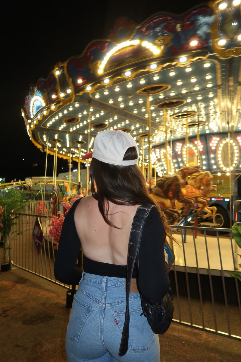 Free People Low Back Seamless Long Sleeve featuring a fitted design with a low back, made from soft, stretchy fabric for a comfortable and sleek look, Black