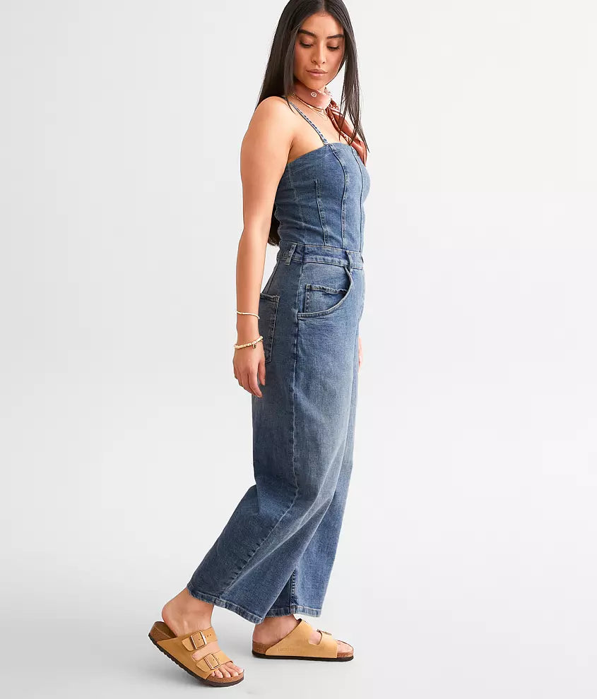 Free People Je Suis Prêt Denim Barrel Jumpsuit – a slim-fit jumpsuit with a corset-inspired bodice, tapered barrel leg, removable straps, five-pocket design, and smocking at the back, Petit Blue