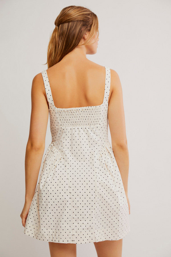 Free People Printed Astrid Mini Dress with a corset-style bodice, gathered bust and hip details, front buttons, and a vintage-inspired print, Ivory Polka-Dot