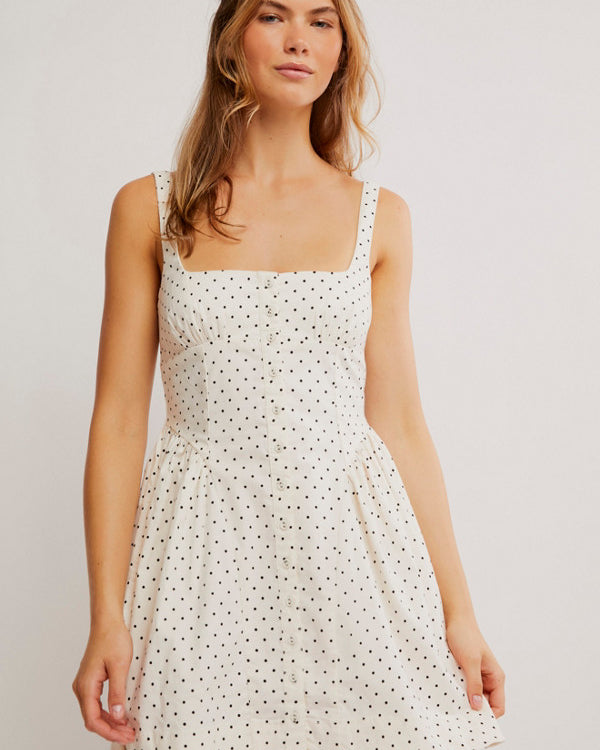 Free People Printed Astrid Mini Dress with a corset-style bodice, gathered bust and hip details, front buttons, and a vintage-inspired print, Ivory Polka-Dot