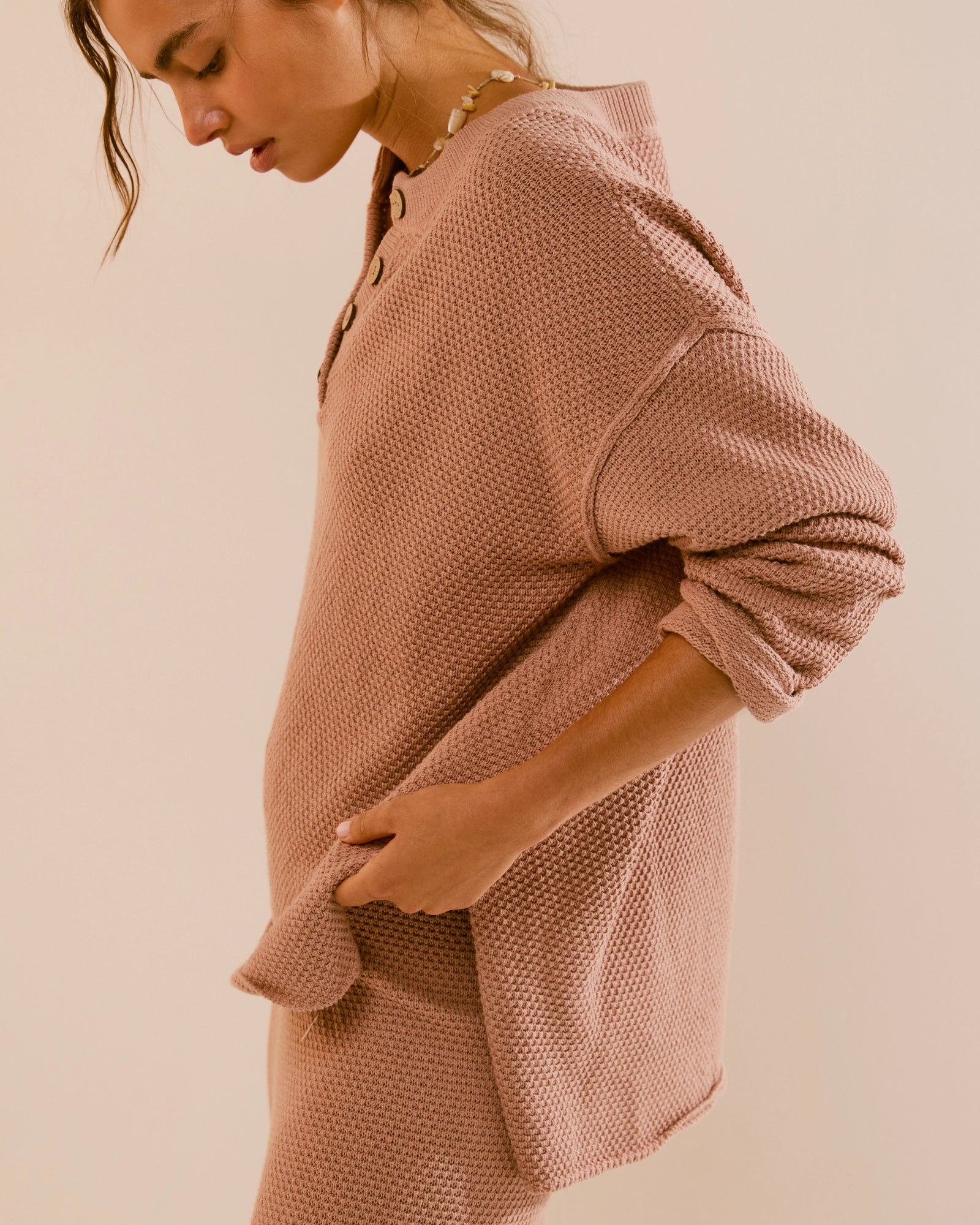 Free People Hailee Sweater Set featuring a soft, ribbed knit long-sleeve sweater and matching high-waisted, wide-leg pants. The relaxed fit of both pieces offers a comfortable and stylish look, perfect for lounging or casual outings, Tuscany