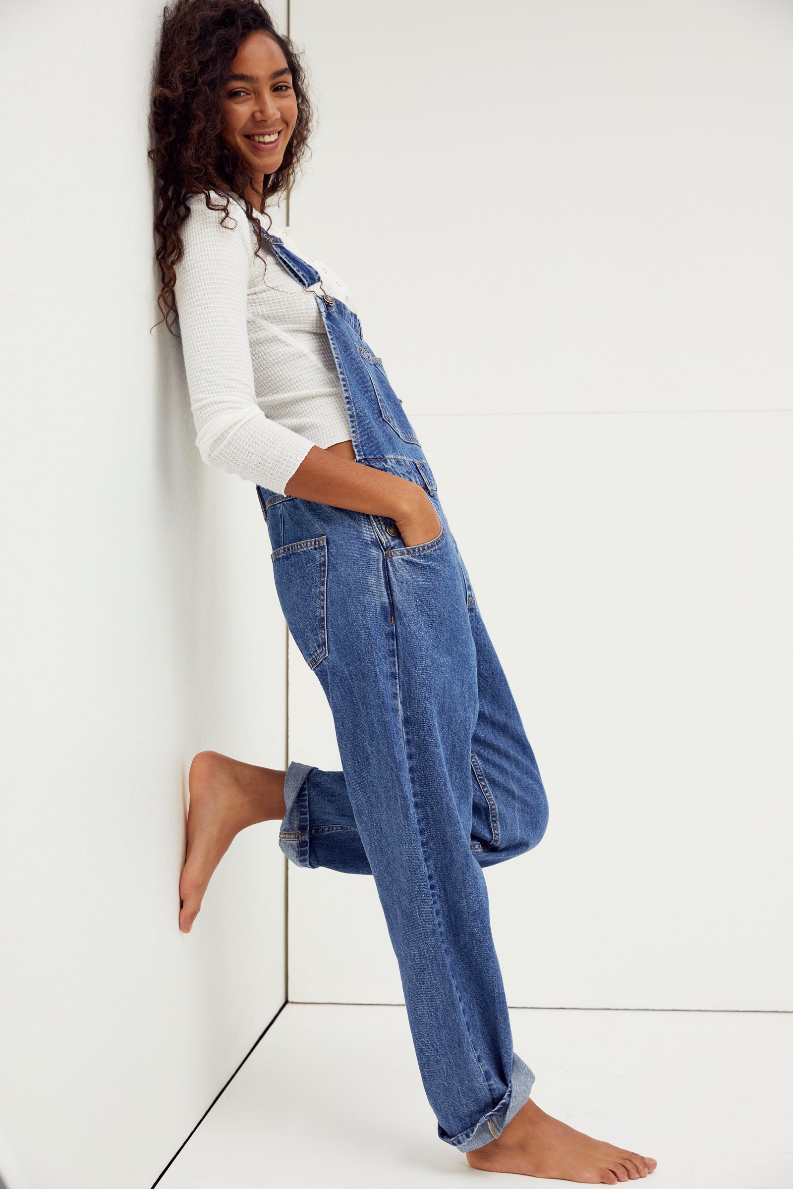 We The Free Ziggy Denim Overalls featuring a relaxed, vintage-inspired fit with wide legs and a distressed, worn-in look. The overalls have adjustable shoulder straps, a front bib pocket, and a button-up closure, offering both style and comfort for everyday wear, Sapphire Blue