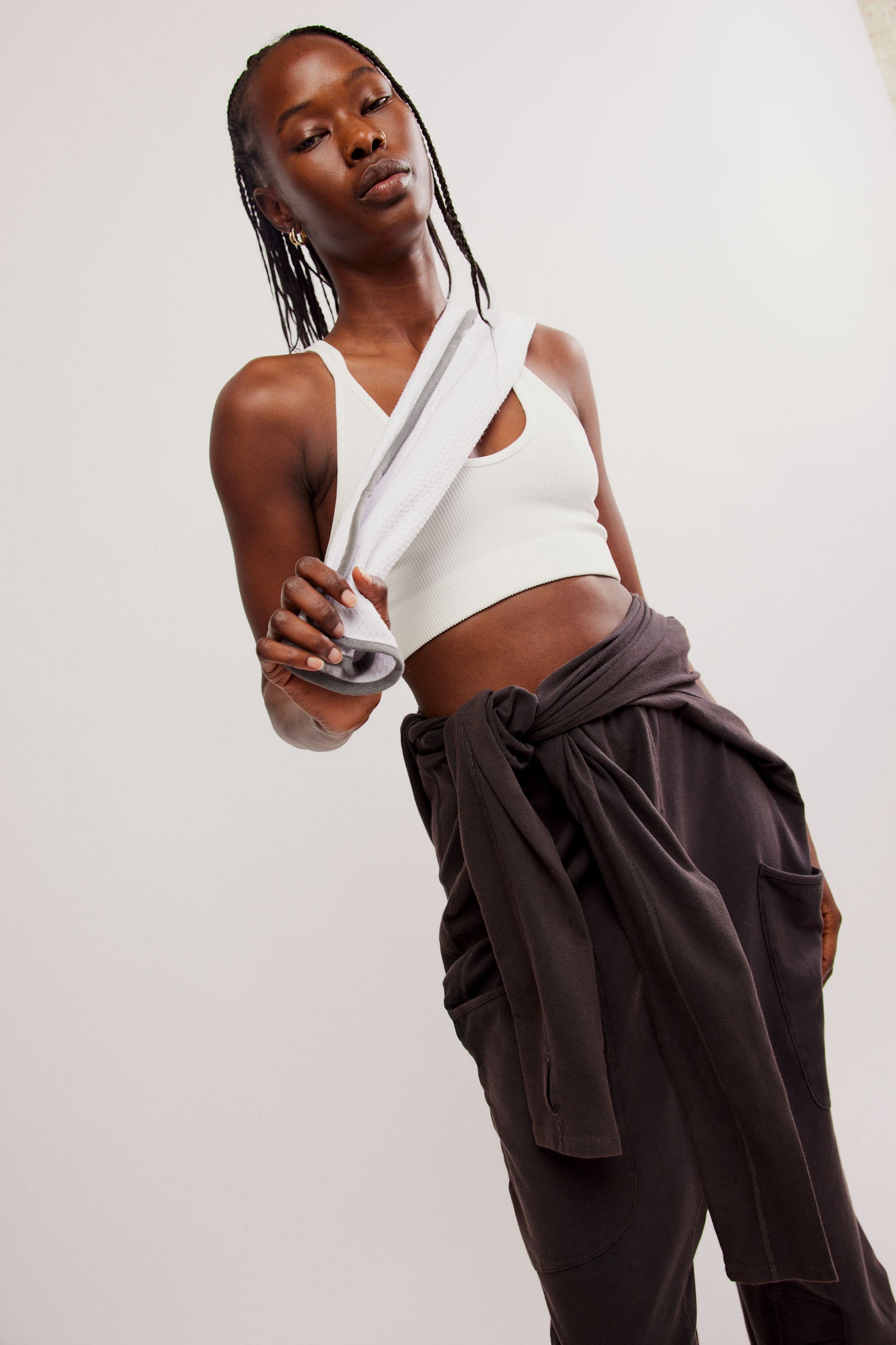 Free People Hot Shot Long Sleeve Onesie made from soft, stretchy fabric with a loose, relaxed design. This one-piece features a scoop neckline and long sleeves, offering a comfortable, laid-back fit that's perfect for layering or wearing on its own, Black