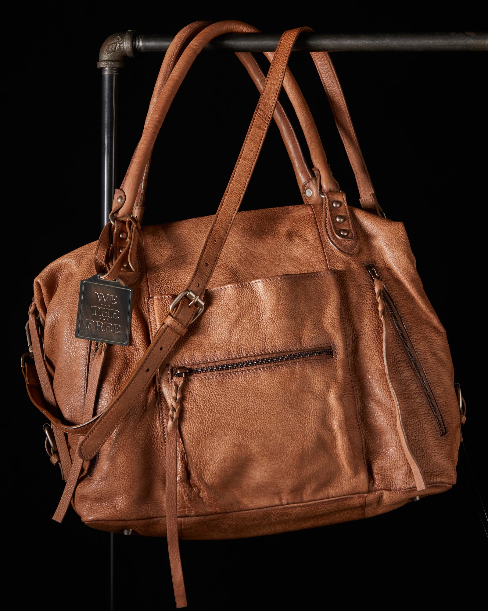 We the Free Emerson Tote Bag showcasing a spacious, simple design with sturdy handles, ideal for carrying essentials in style, Saddle