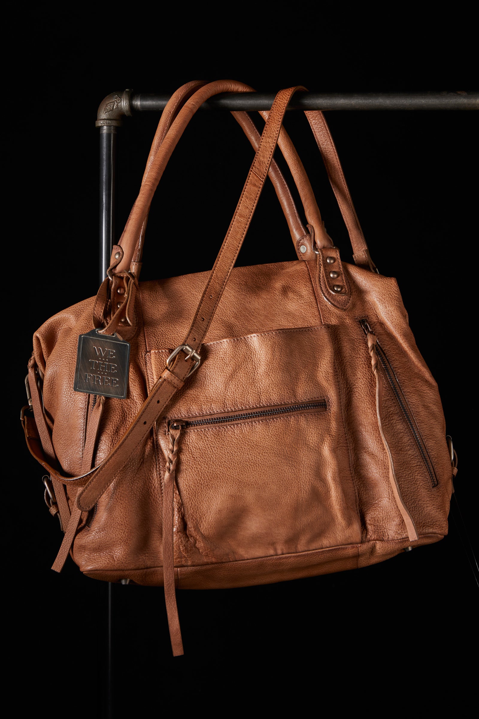 We the Free Emerson Tote Bag showcasing a spacious, simple design with sturdy handles, ideal for carrying essentials in style, Saddle