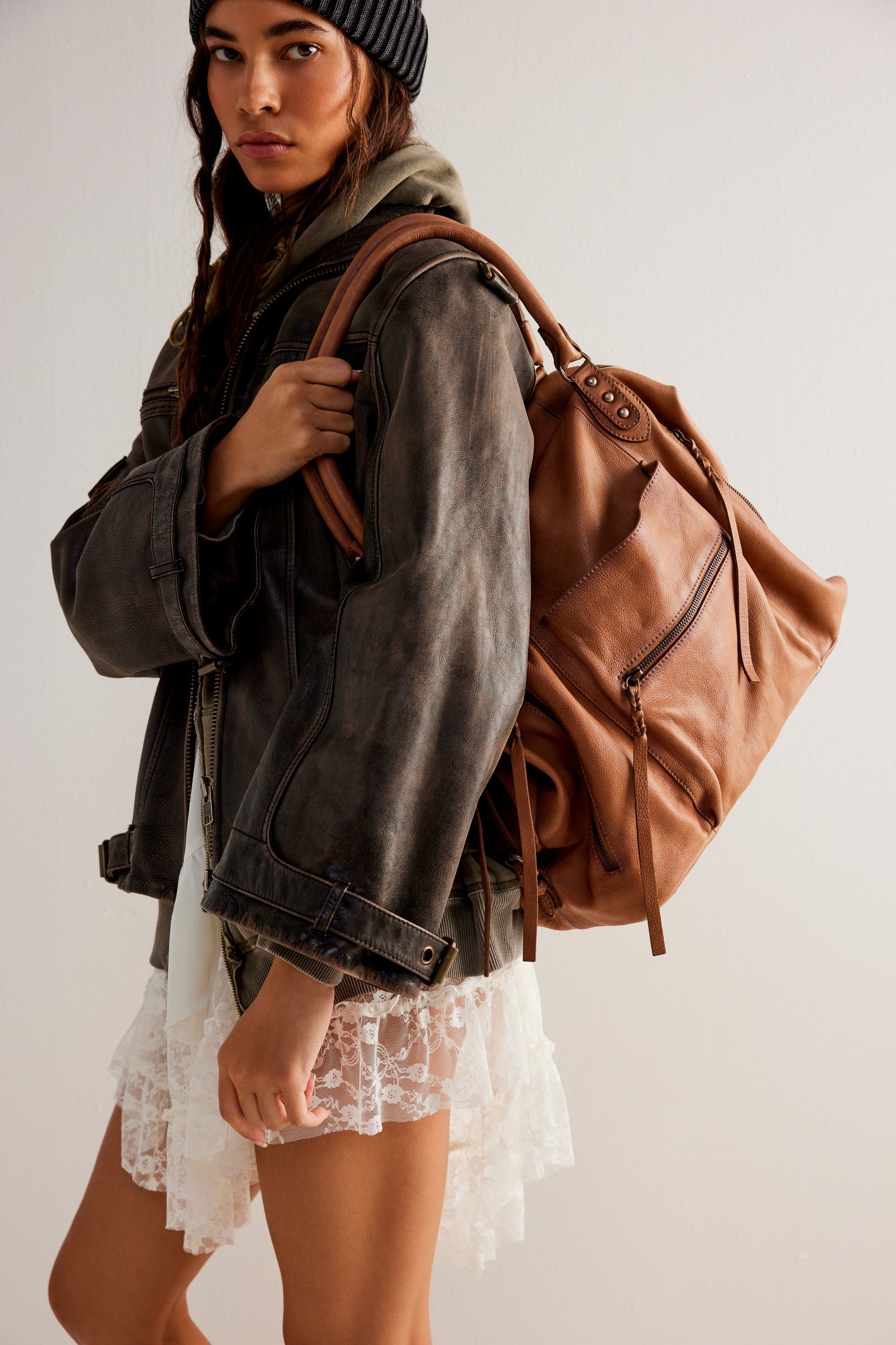 We the Free Emerson Tote Bag showcasing a spacious, simple design with sturdy handles, ideal for carrying essentials in style, Saddle