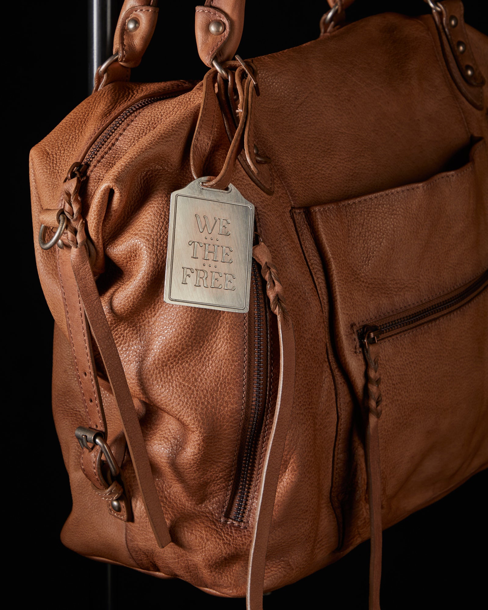 We the Free Emerson Tote Bag showcasing a spacious, simple design with sturdy handles, ideal for carrying essentials in style, Saddle