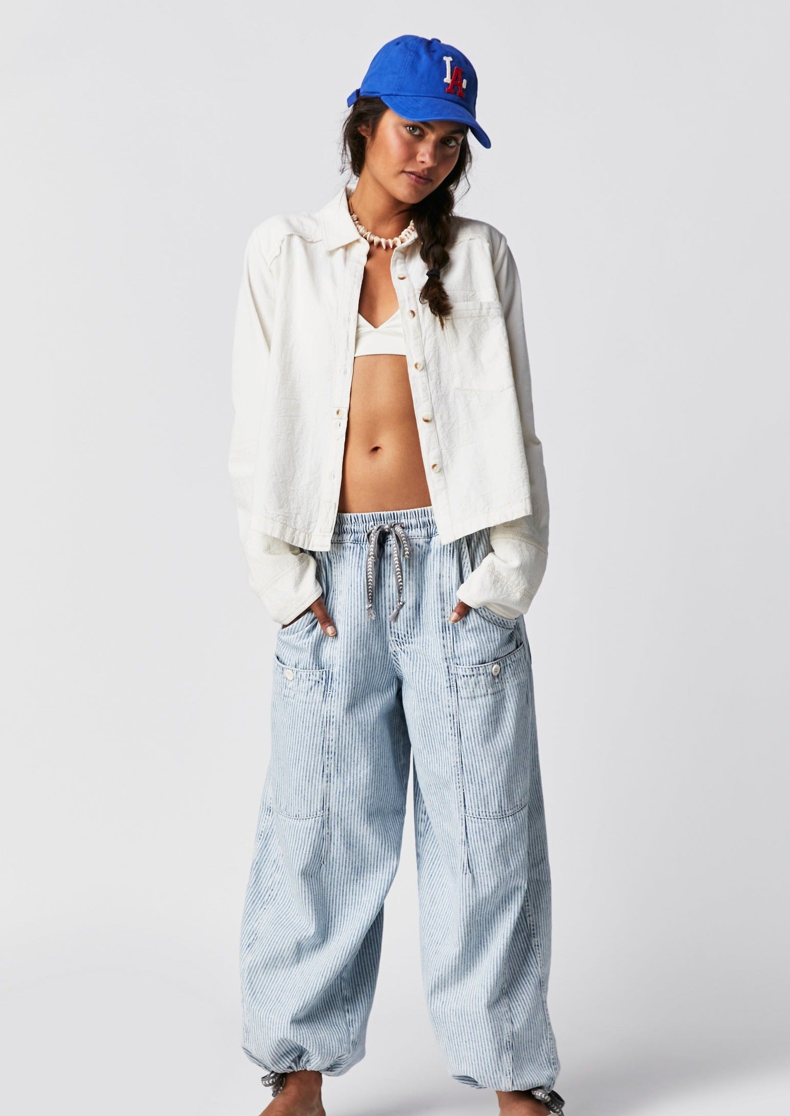 Free People Classic Oxford Top – A timeless button-down shirt with a relaxed fit, featuring a crisp, structured design and rolled-up sleeves for a casual, effortless look, Ivory