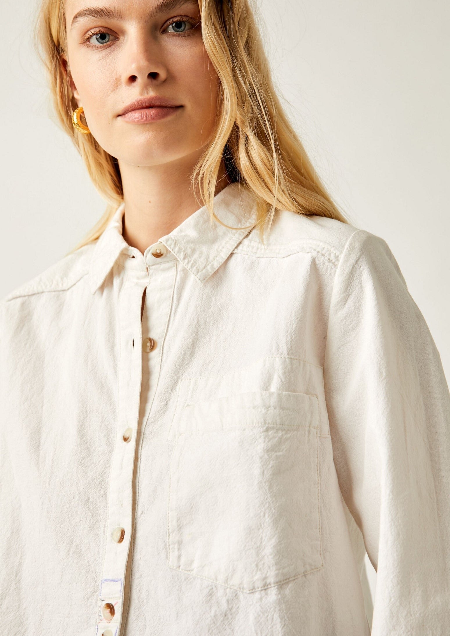 Free People Classic Oxford Top – A timeless button-down shirt with a relaxed fit, featuring a crisp, structured design and rolled-up sleeves for a casual, effortless look, Ivory