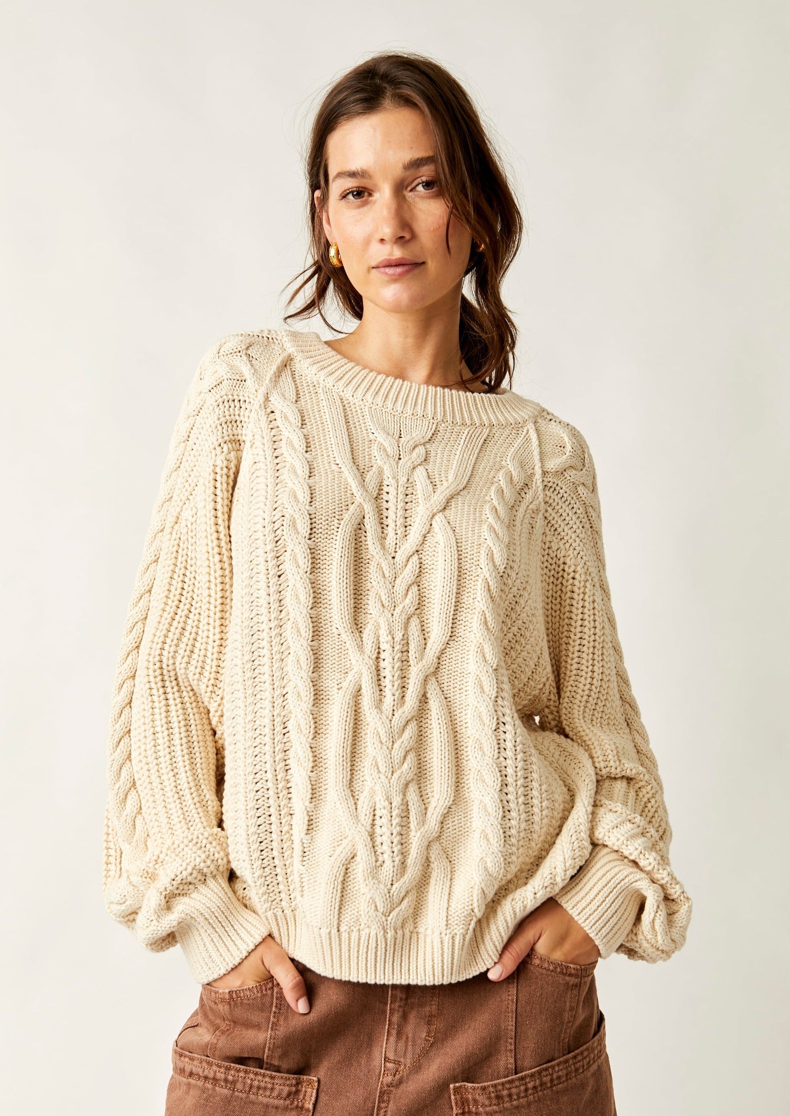 Free People Frankie Cable Sweater featuring a cozy knit design with textured cable detailing, a relaxed fit, and a slightly oversized silhouette, perfect for layering or wearing on its own for a casual, comfy look, Ivory