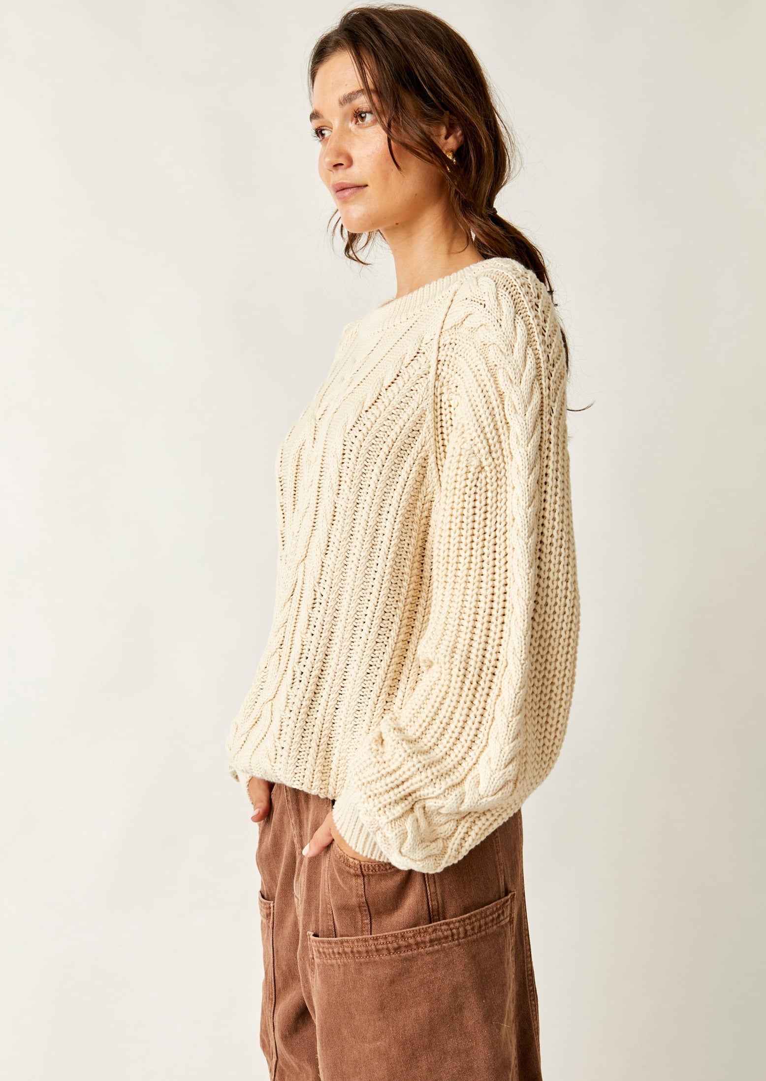 Free People Frankie Cable Sweater featuring a cozy knit design with textured cable detailing, a relaxed fit, and a slightly oversized silhouette, perfect for layering or wearing on its own for a casual, comfy look, Ivory
