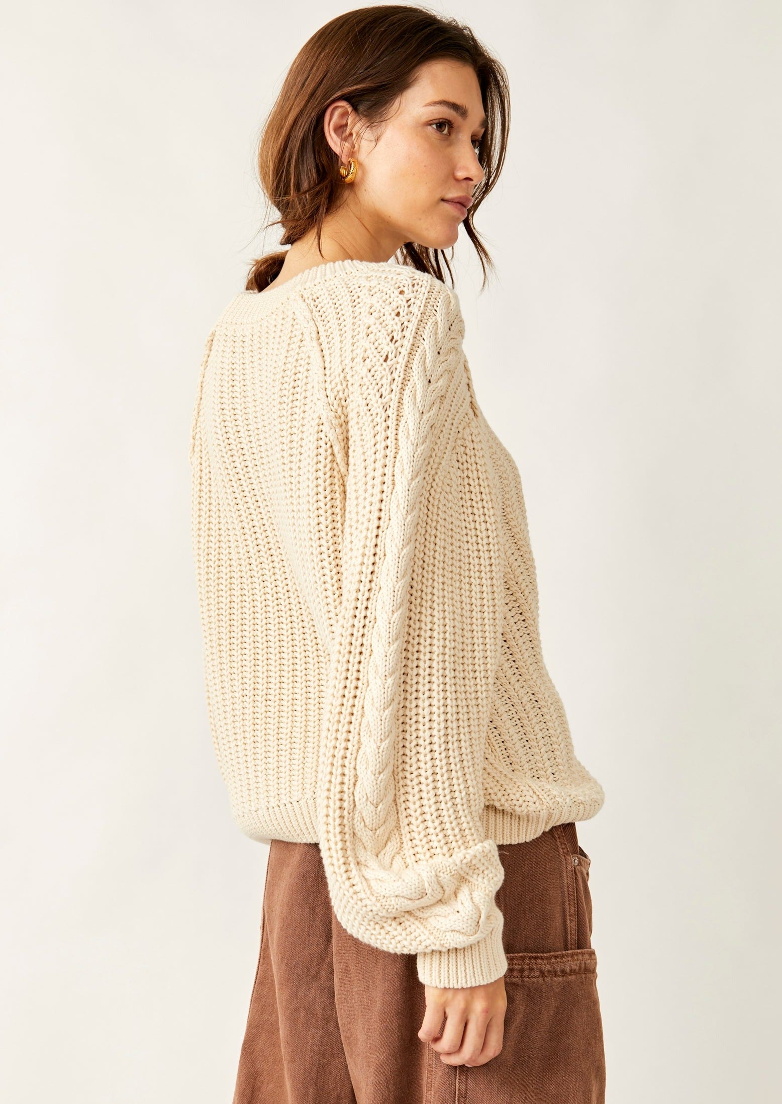 Free People Frankie Cable Sweater featuring a cozy knit design with textured cable detailing, a relaxed fit, and a slightly oversized silhouette, perfect for layering or wearing on its own for a casual, comfy look, Ivory