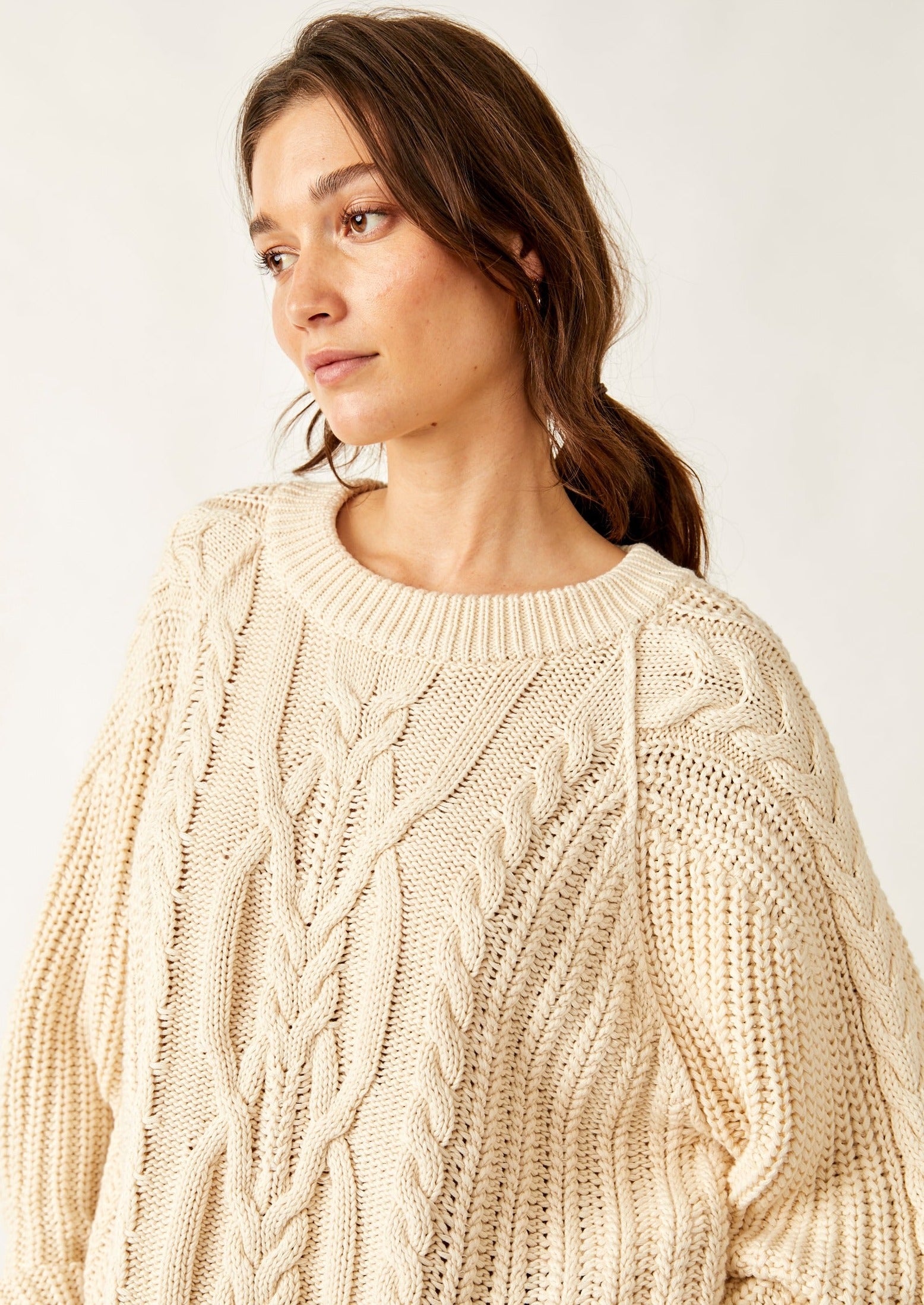 Free People Frankie Cable Sweater featuring a cozy knit design with textured cable detailing, a relaxed fit, and a slightly oversized silhouette, perfect for layering or wearing on its own for a casual, comfy look, Ivory