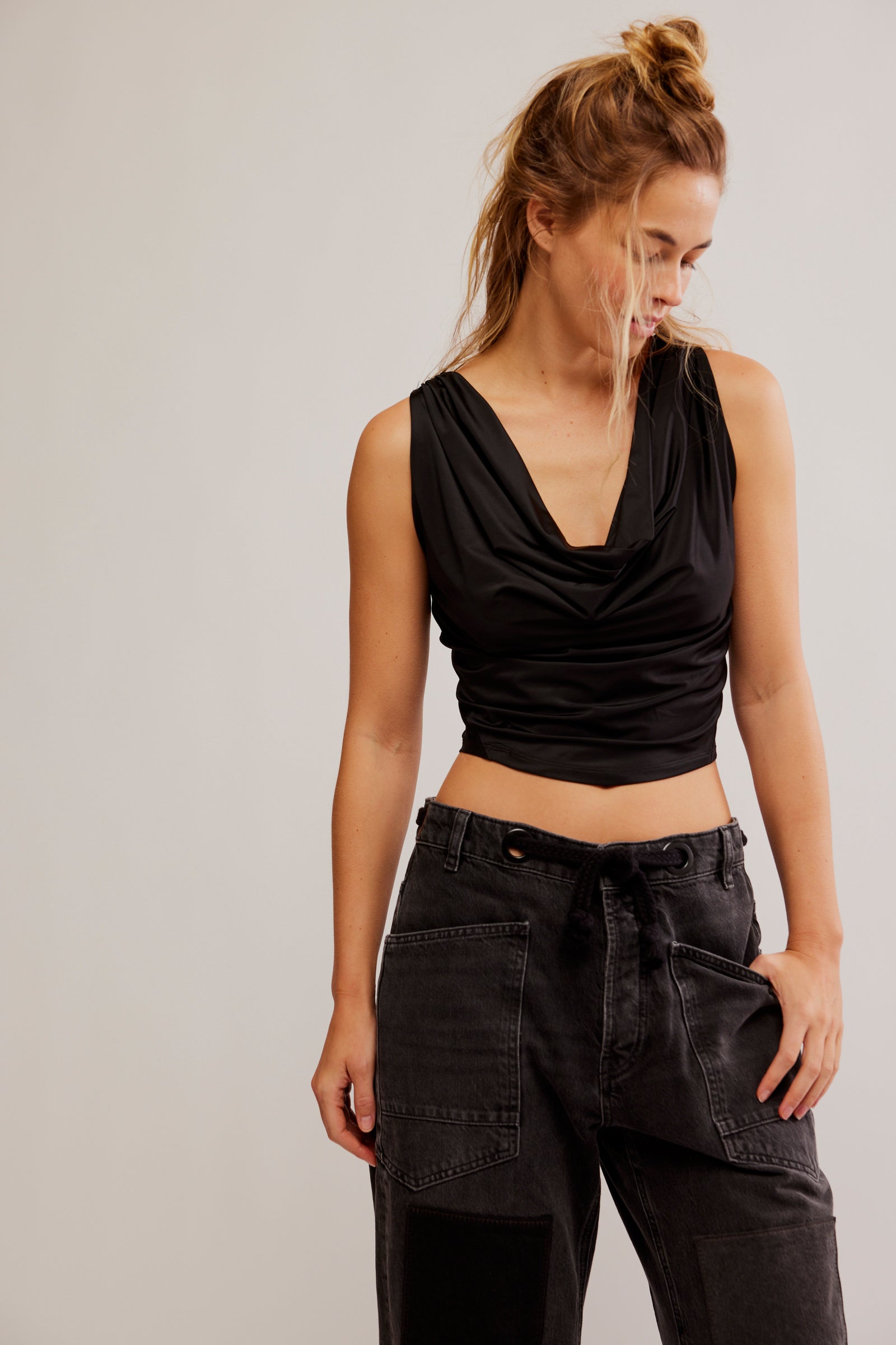 Free People City Nights Tuck In Top featuring soft, lightweight fabric with a slim fit and a cowl neckline. This top has a tucked-in waist design, Black