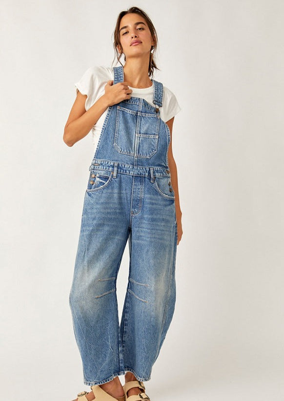We The Free Good Luck Barrel Overalls with a relaxed, loose-fit design and wide-leg silhouette. These overalls feature adjustable straps and a soft, distressed denim fabric, offering a casual, boho-inspired look with a comfortable, laid-back feel, Ultra Light Beam