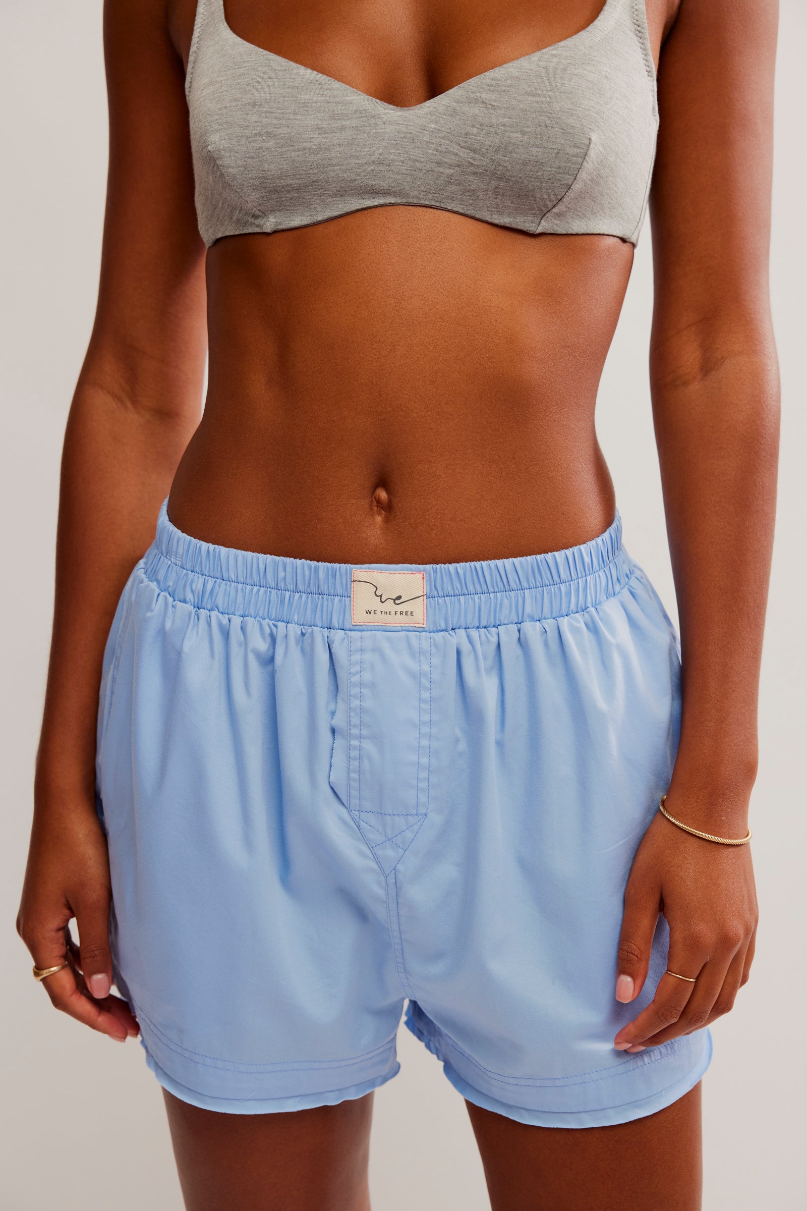 We The Free Day to Day Solid Boxer made from soft, lightweight fabric with an easy, relaxed fit. These boxers feature an elastic waistband and a comfortable, minimalistic design, perfect for lounging or pairing with casual outfits for a laid-back, effortless style, Placid Blue
