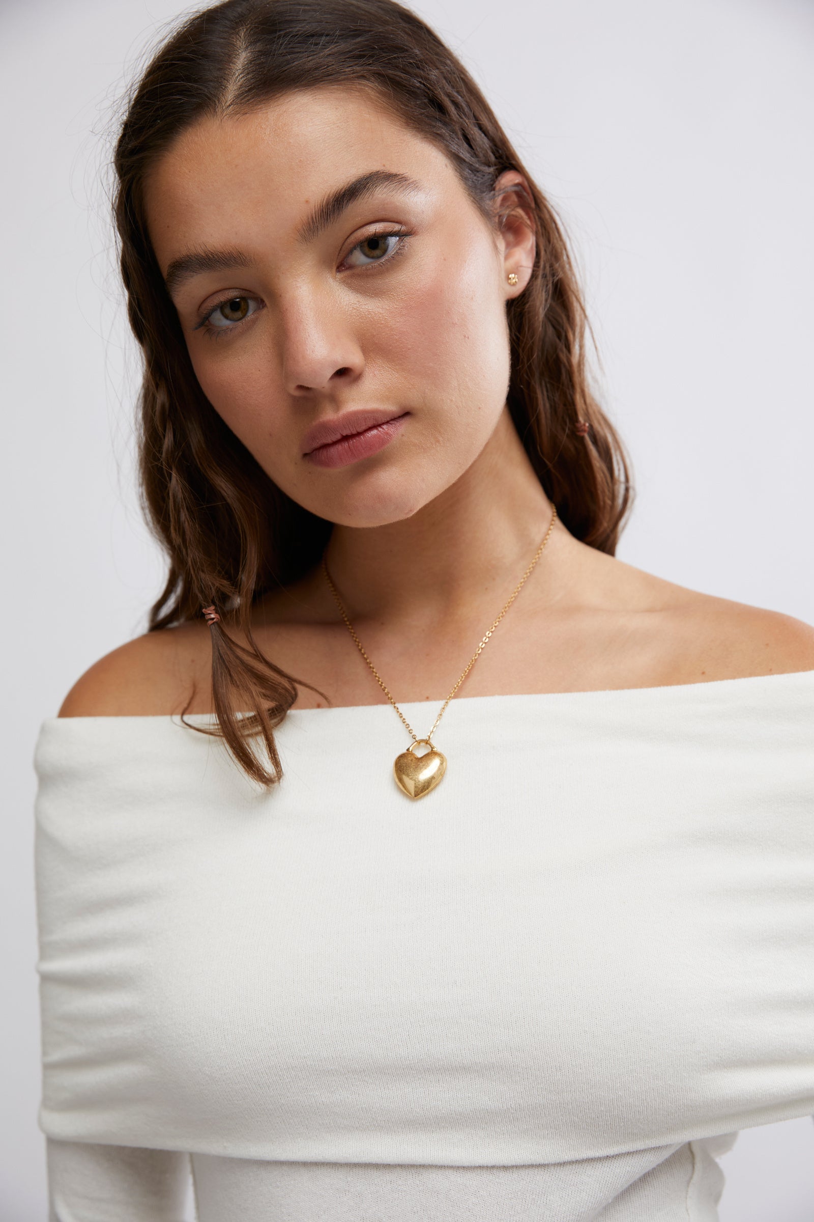 Free People Iris Layering Top made from soft, stretchy fabric with an off-the-shoulder design. This fitted long-sleeve top offers a sleek, minimalistic look, perfect for layering under jackets or sweaters for a cozy yet stylish feel, White