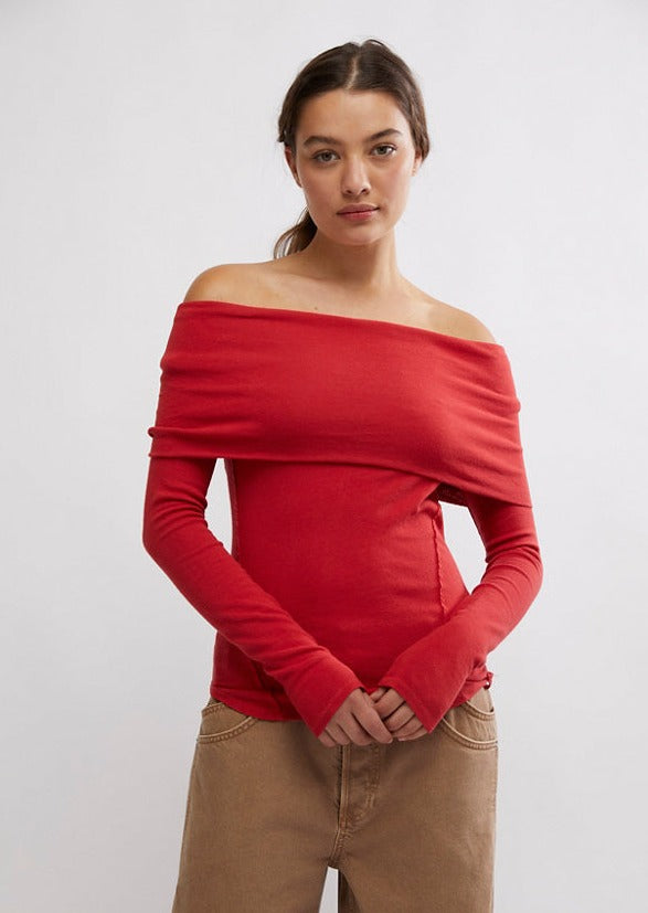 Free People Iris Layering Top made from soft, stretchy fabric with an off-the-shoulder design. This fitted long-sleeve top offers a sleek, minimalistic look, perfect for layering under jackets or sweaters for a cozy yet stylish feel, Samba