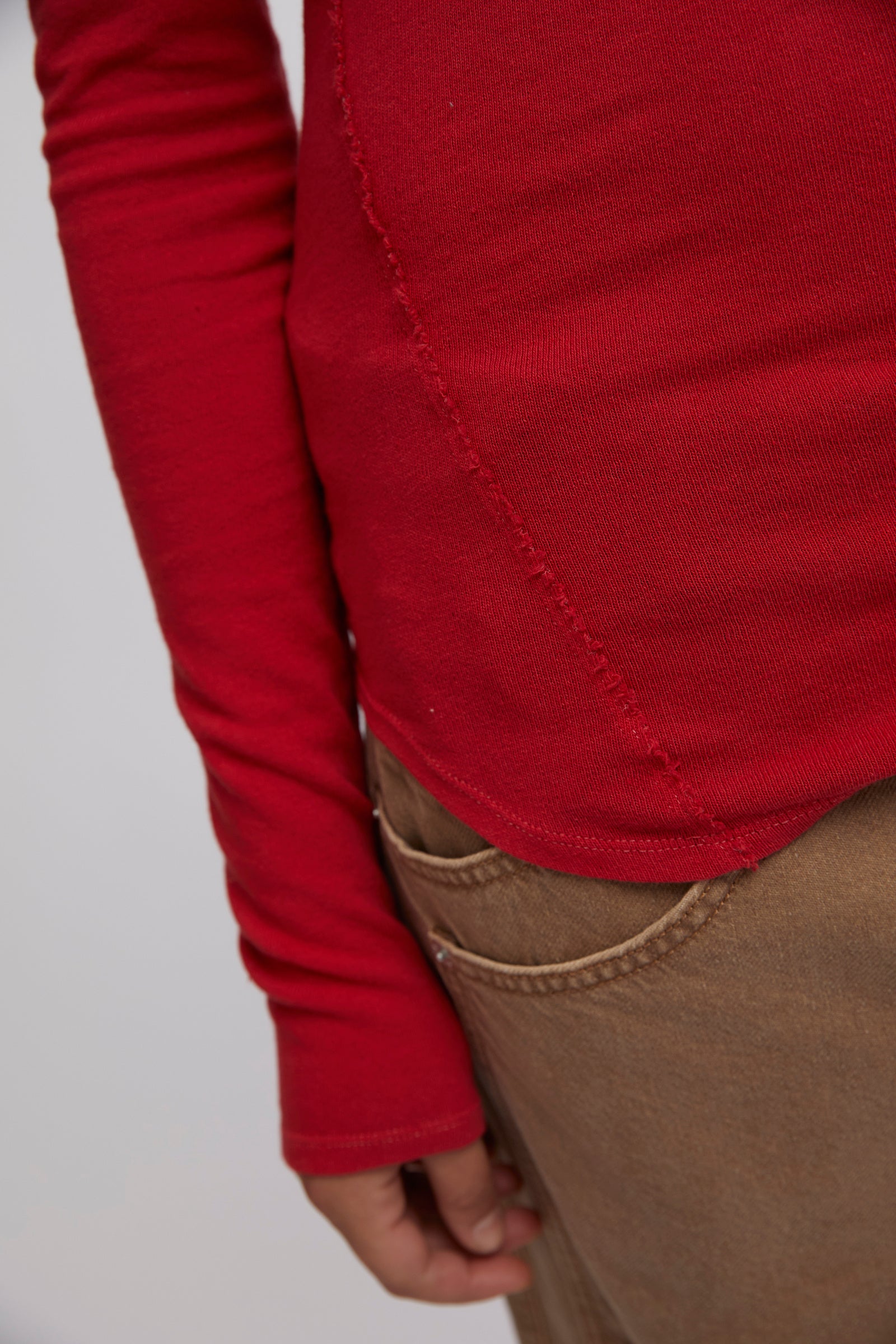 Free People Iris Layering Top made from soft, stretchy fabric with an off-the-shoulder design. This fitted long-sleeve top offers a sleek, minimalistic look, perfect for layering under jackets or sweaters for a cozy yet stylish feel, Samba