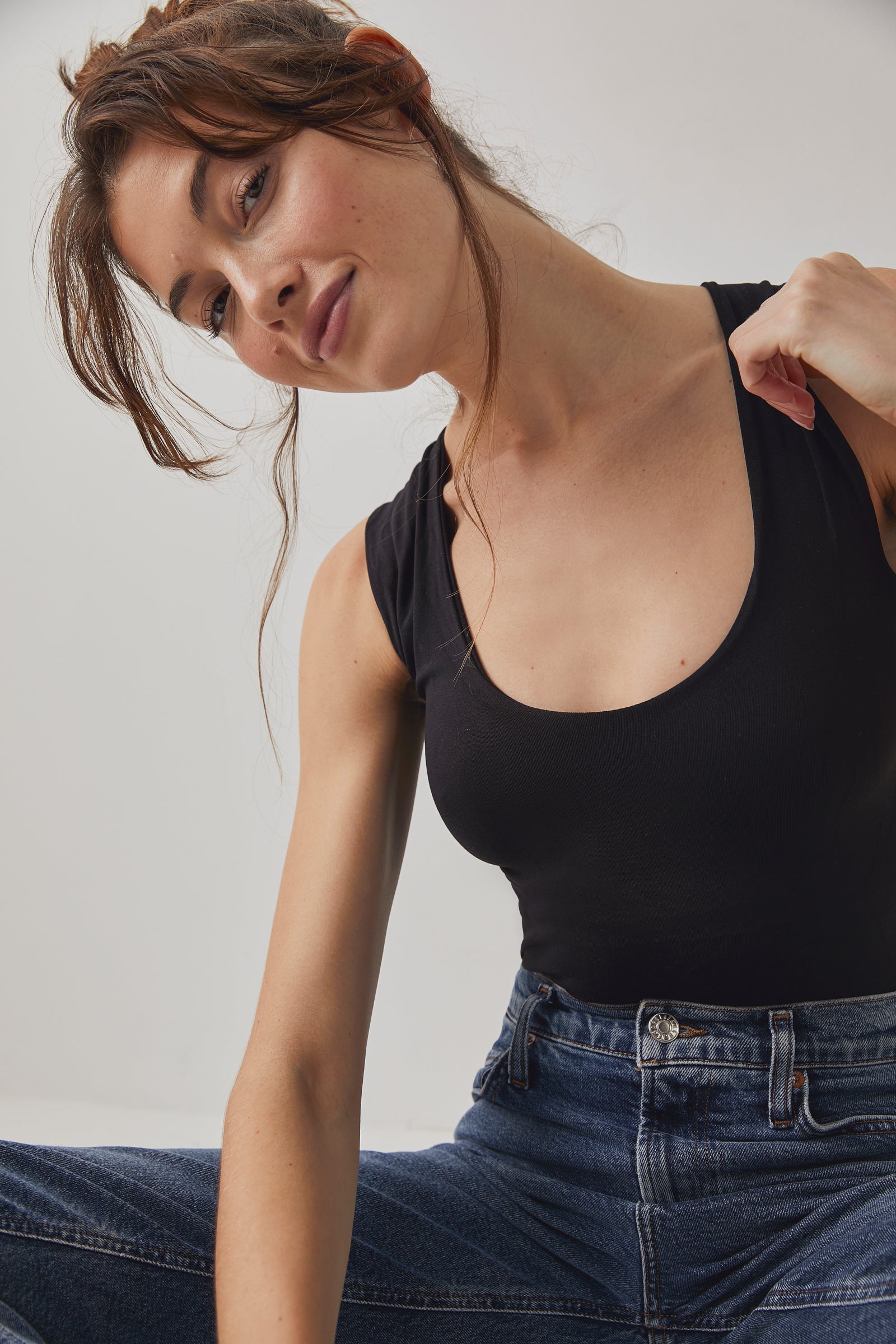 Free People Clean Lines Muscle Cami featuring a relaxed fit, sleeveless design, and scoop neckline, made from soft fabric for an easy, comfortable style, Black