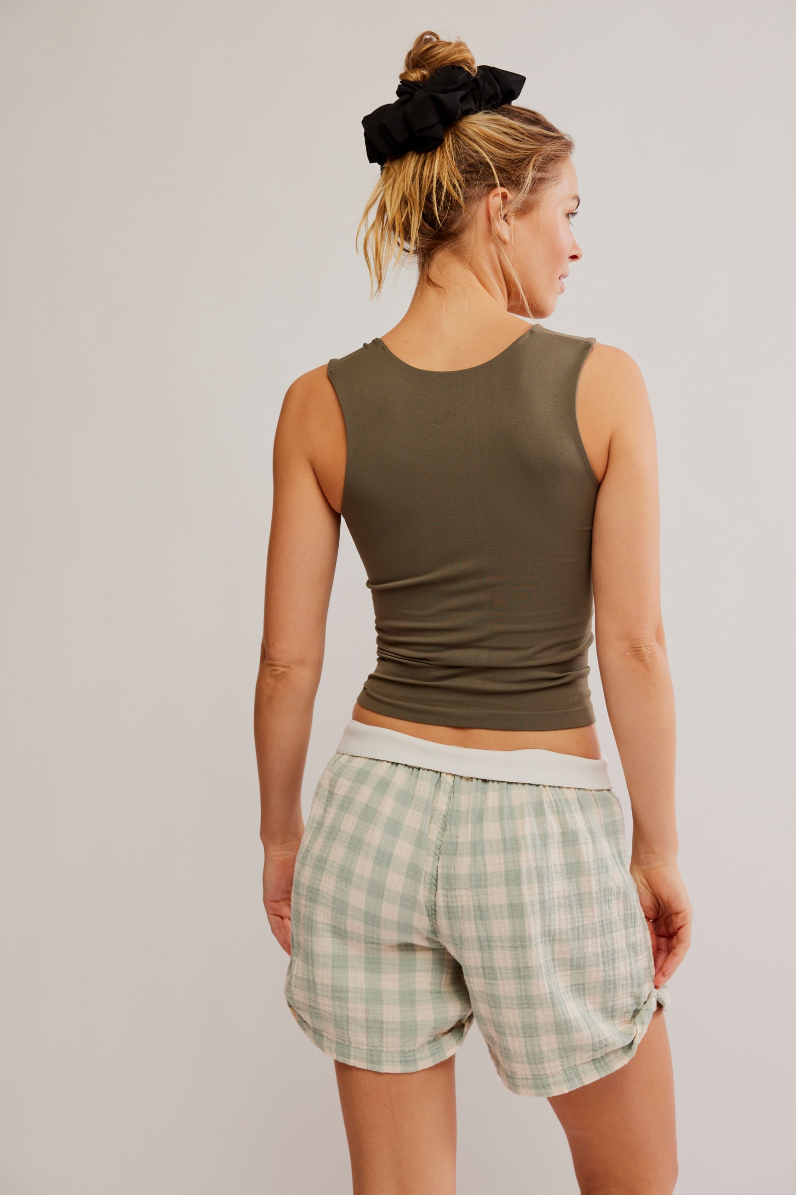 Free People Clean Lines Muscle Cami featuring a relaxed fit, sleeveless design, and scoop neckline, made from soft fabric for an easy, comfortable style, Tarmac