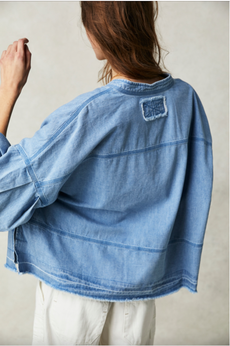 Free People Jude Denim Pullover made from soft, lightweight denim fabric. This relaxed-fit, long-sleeve top features a V-neckline and a casual, easygoing silhouette, offering a laid-back, vintage-inspired style, Vintage Indigo