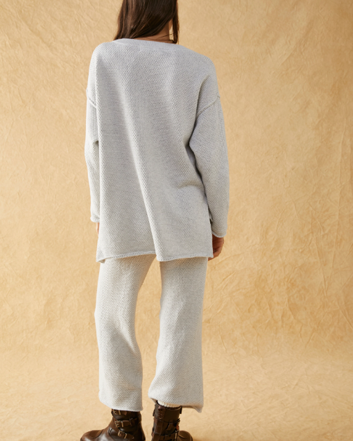 Free People Hailee Sweater Set featuring a soft, ribbed knit long-sleeve sweater and matching high-waisted, wide-leg pants. The relaxed fit of both pieces offers a comfortable and stylish look, perfect for lounging or casual outings, Ivory Heather