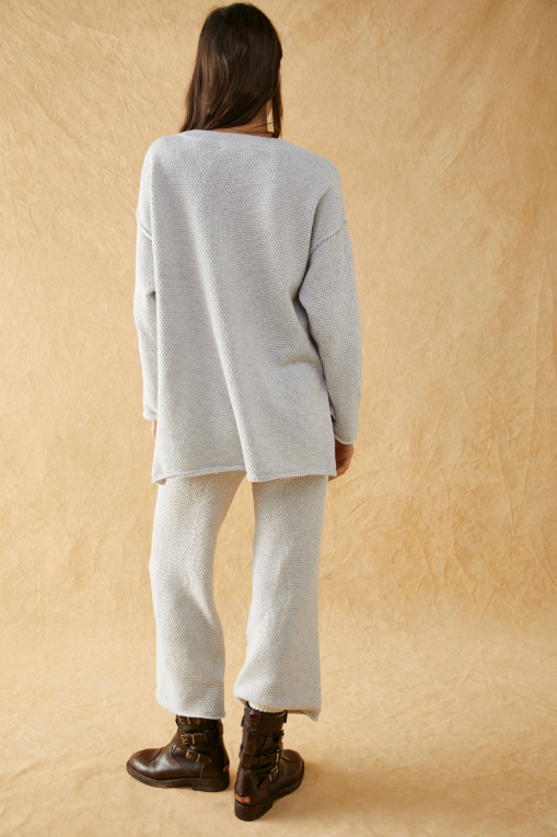 Free People Hailee Sweater Set featuring a soft, ribbed knit long-sleeve sweater and matching high-waisted, wide-leg pants. The relaxed fit of both pieces offers a comfortable and stylish look, perfect for lounging or casual outings, Ivory Heather