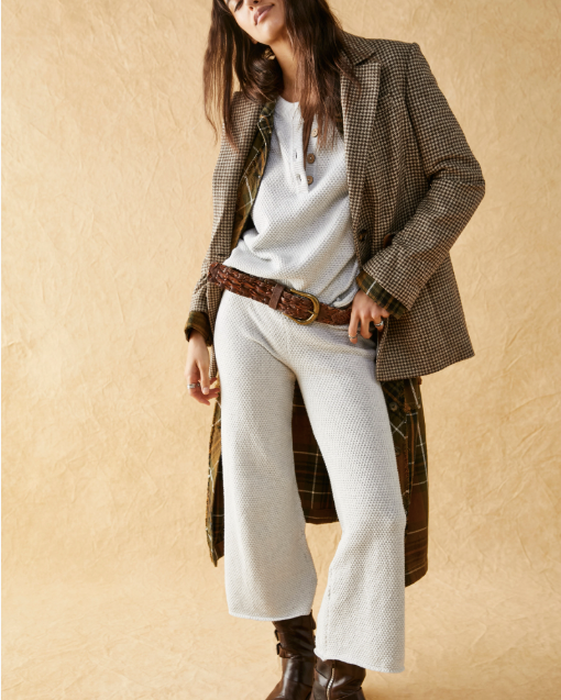 Free People Hailee Sweater Set featuring a soft, ribbed knit long-sleeve sweater and matching high-waisted, wide-leg pants. The relaxed fit of both pieces offers a comfortable and stylish look, perfect for lounging or casual outings, Ivory Heather