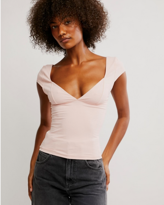 Free People Duo Corset Cami with a sweetheart neckline, capped sleeves, seamed cup design, and sculpting Duo fabric featuring a compressive mesh underlayer, Ballet