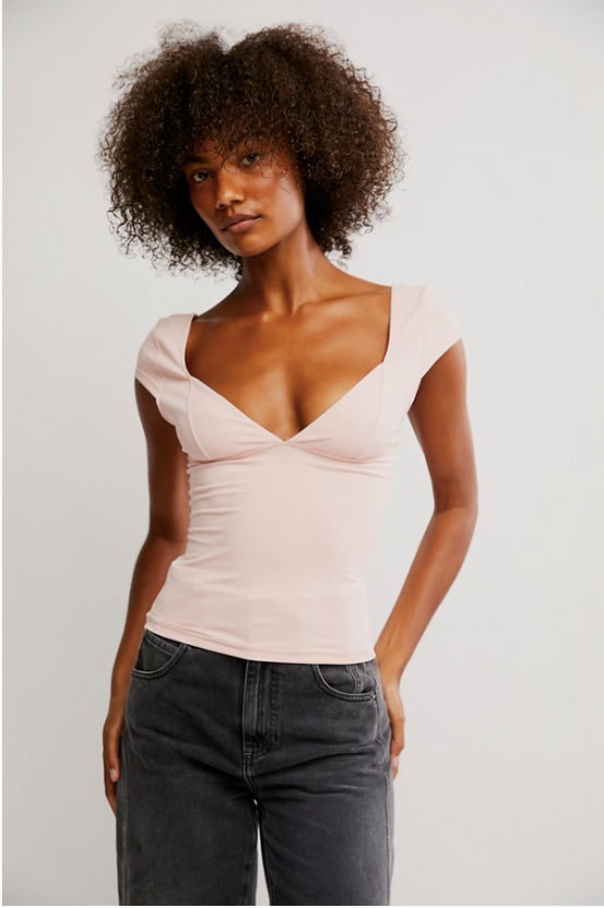 Free People Duo Corset Cami with a sweetheart neckline, capped sleeves, seamed cup design, and sculpting Duo fabric featuring a compressive mesh underlayer, Ballet