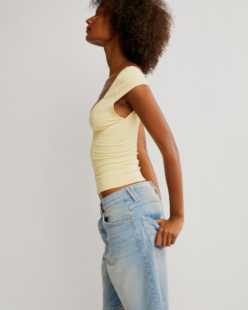 Free People Duo Corset Cami with a sweetheart neckline, capped sleeves, seamed cup design, and sculpting Duo fabric featuring a compressive mesh underlayer, Banana Cream