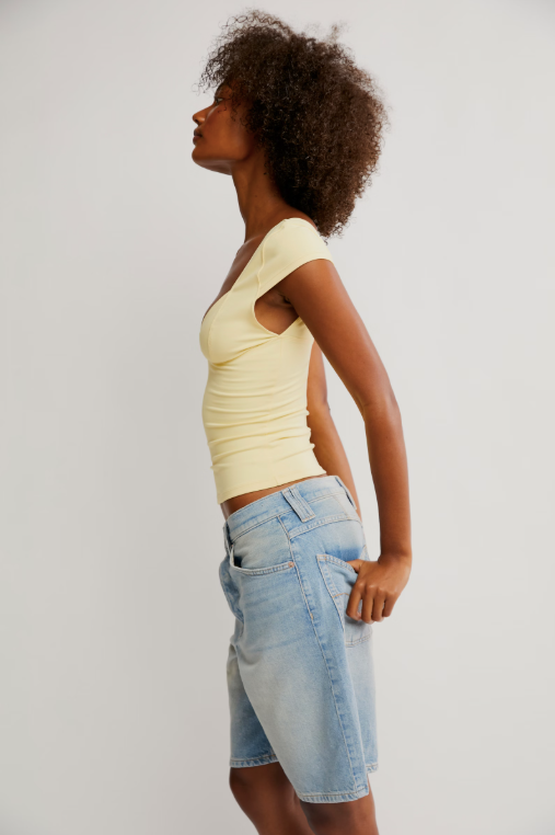 Free People Duo Corset Cami with a sweetheart neckline, capped sleeves, seamed cup design, and sculpting Duo fabric featuring a compressive mesh underlayer, Banana Cream