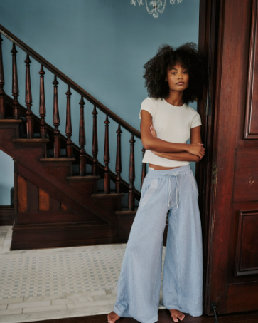 Free People Wait a Minute Baby Tee with a cropped, fitted design, short sleeves, and a soft, stretchy fabric, Oatmeal