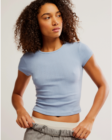 Free People Wait a Minute Baby Tee with a cropped, fitted design, short sleeves, and a soft, stretchy fabric, Soft Chambray