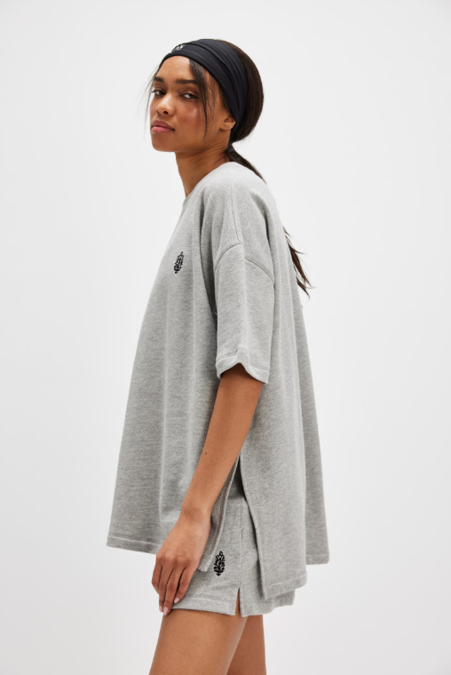 Free People Back Me Up Set – A relaxed, breathable two-piece set featuring a tunic-style top with side seam slits and a crew neckline, paired with high-rise shorts with side pockets and a dropped inseam, Heather Grey