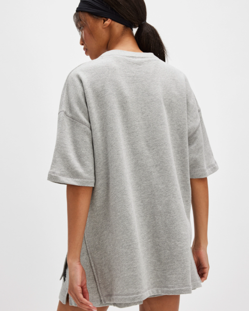 Free People Back Me Up Set – A relaxed, breathable two-piece set featuring a tunic-style top with side seam slits and a crew neckline, paired with high-rise shorts with side pockets and a dropped inseam, Heather Grey