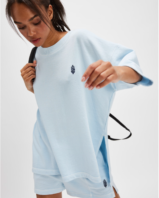 Free People Back Me Up Set – A relaxed, breathable two-piece set featuring a tunic-style top with side seam slits and a crew neckline, paired with high-rise shorts with side pockets and a dropped inseam, Baseline Blue