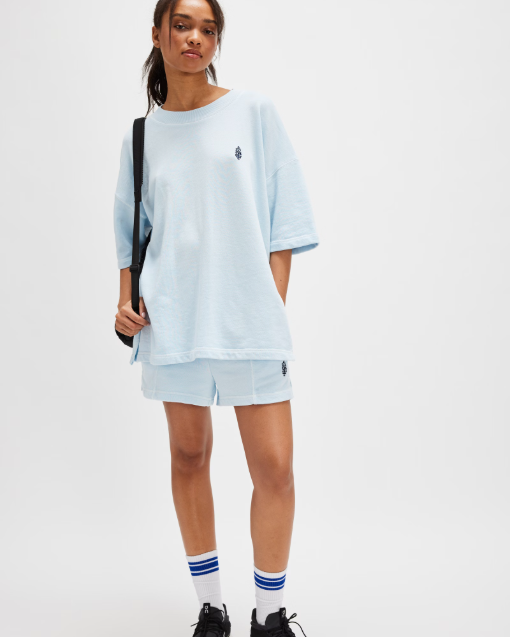 Free People Back Me Up Set – A relaxed, breathable two-piece set featuring a tunic-style top with side seam slits and a crew neckline, paired with high-rise shorts with side pockets and a dropped inseam, Baseline Blue