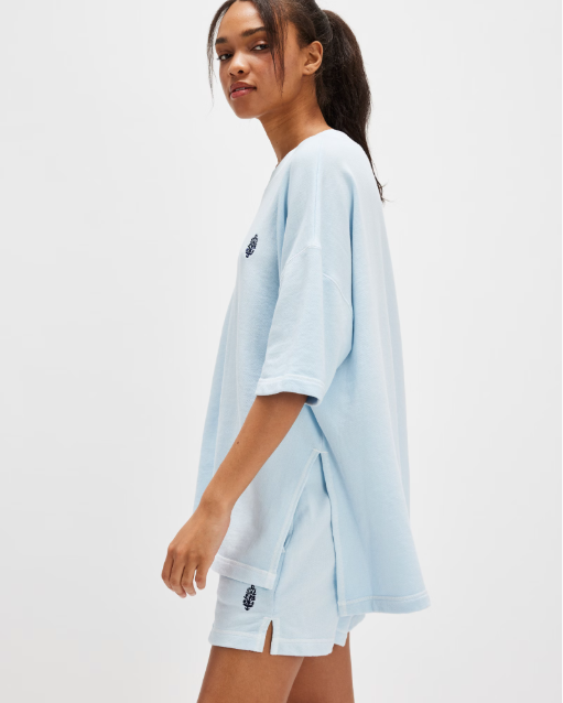 Free People Back Me Up Set – A relaxed, breathable two-piece set featuring a tunic-style top with side seam slits and a crew neckline, paired with high-rise shorts with side pockets and a dropped inseam, Baseline Blue