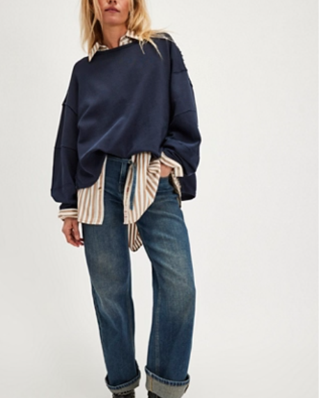 "We The Free Total Eclipse Tee" in an oversized, long-sleeve ribbed cotton fabric. The shirt features a wide scoop neckline, dropped shoulders, and exposed raw seams, Deeper Iris