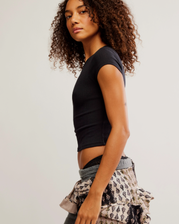 Free People Wait a Minute Baby Tee with a cropped, fitted design, short sleeves, and a soft, stretchy fabric, Black