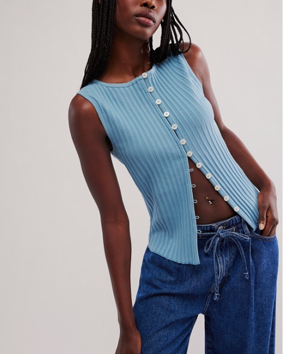 Free People Tilly Vest made from a soft, textured fabric with a relaxed, sleeveless design. This button-front vest offers a stylish and lightweight layering piece, perfect for adding a chic touch to any outfit, Ocean View