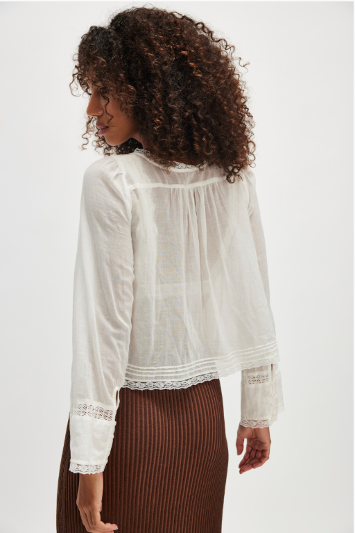 Free People Long Sleeve Forevermore Top – a relaxed, slightly cropped long-sleeve top with a square neckline, tie detail, button closures, and sheer lace trim, Ivory