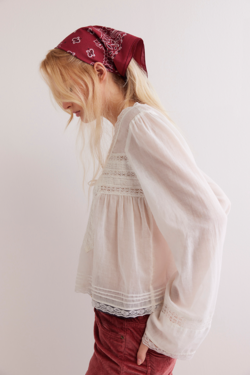 Free People Long Sleeve Forevermore Top – a relaxed, slightly cropped long-sleeve top with a square neckline, tie detail, button closures, and sheer lace trim, Ivory