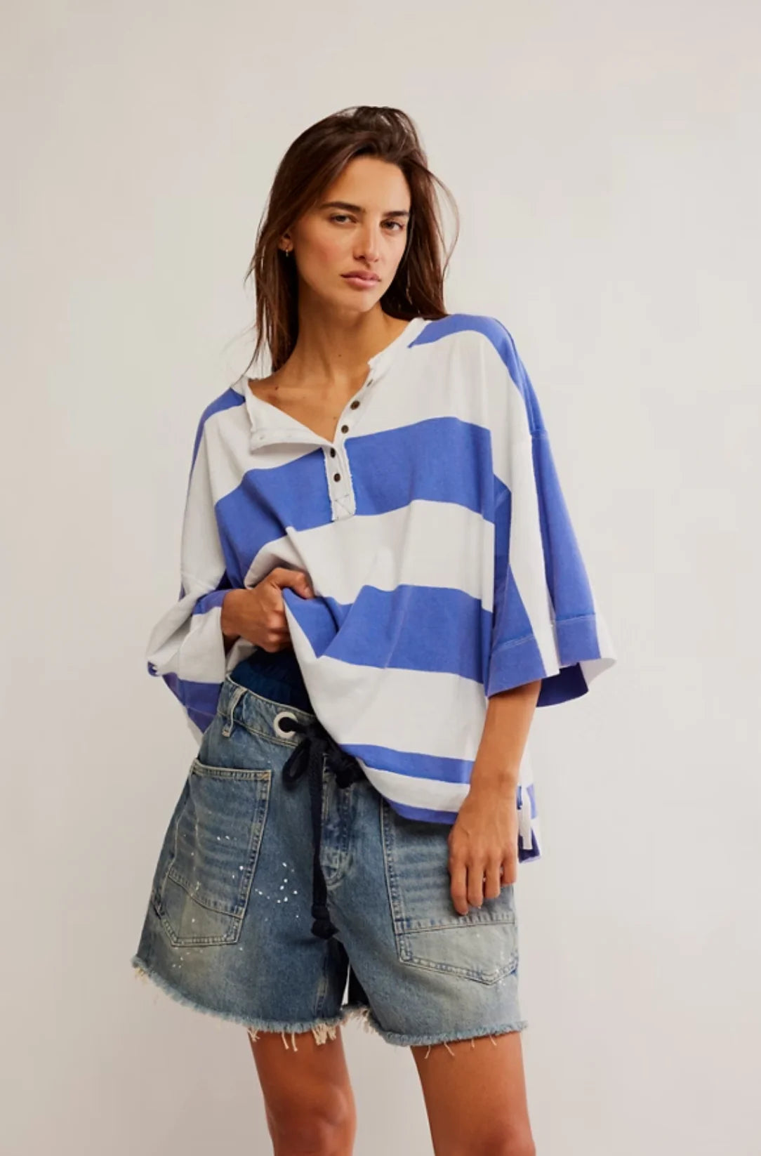 Free People Wonderful Tee featuring a relaxed, oversized fit with a deep V-neck and short sleeves. Made from soft, lightweight fabric, this casual tee offers a comfortable, laid-back style, perfect for everyday wear, Blue Combo