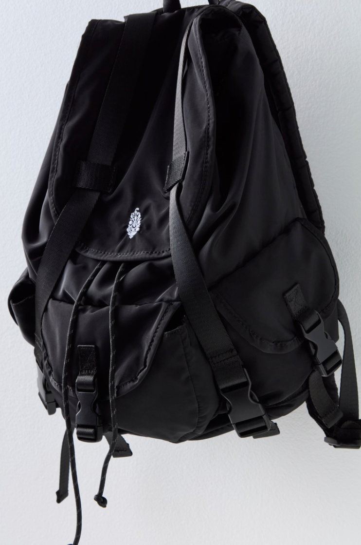 Free People The Adventure Pack – a functional, lightweight backpack with multiple zip compartments, adjustable straps, and a compact design perfect for on-the-go, Black