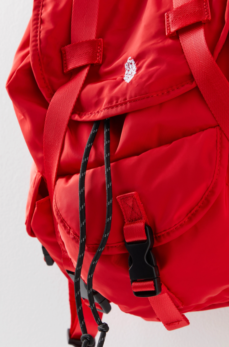Free People The Adventure Pack – a functional, lightweight backpack with multiple zip compartments, adjustable straps, and a compact design perfect for on-the-go, Red