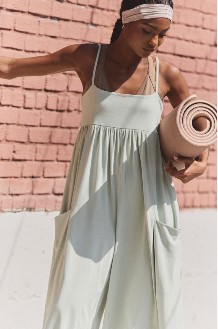 Free People Hot Shot Strappy Onesie, featuring soft cotton-blend fabric, simple shoulder straps, empire waist, and wide-leg slouchy fit, Green Tea